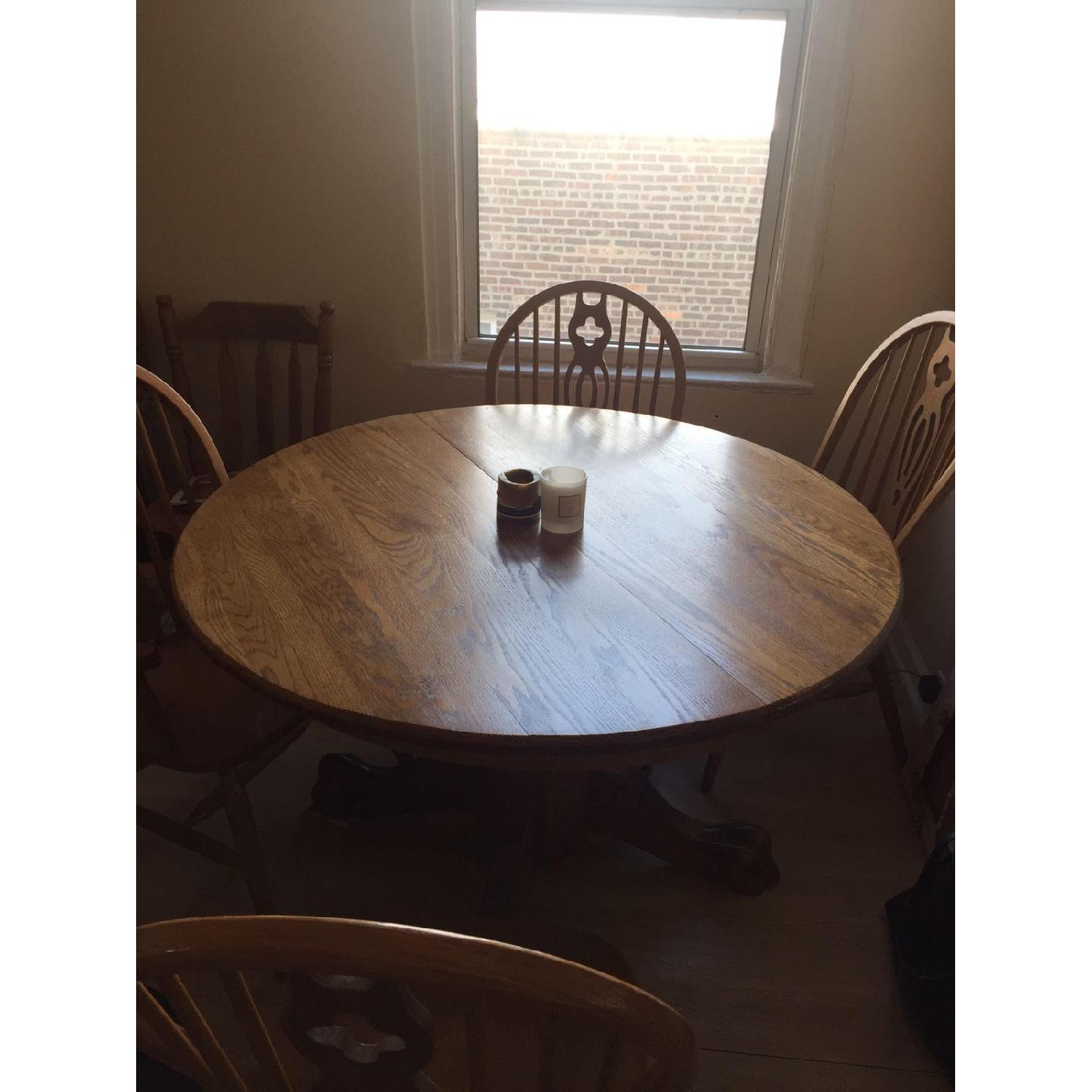 Round Oak Dining Table w/ 4 Chairs - AptDeco