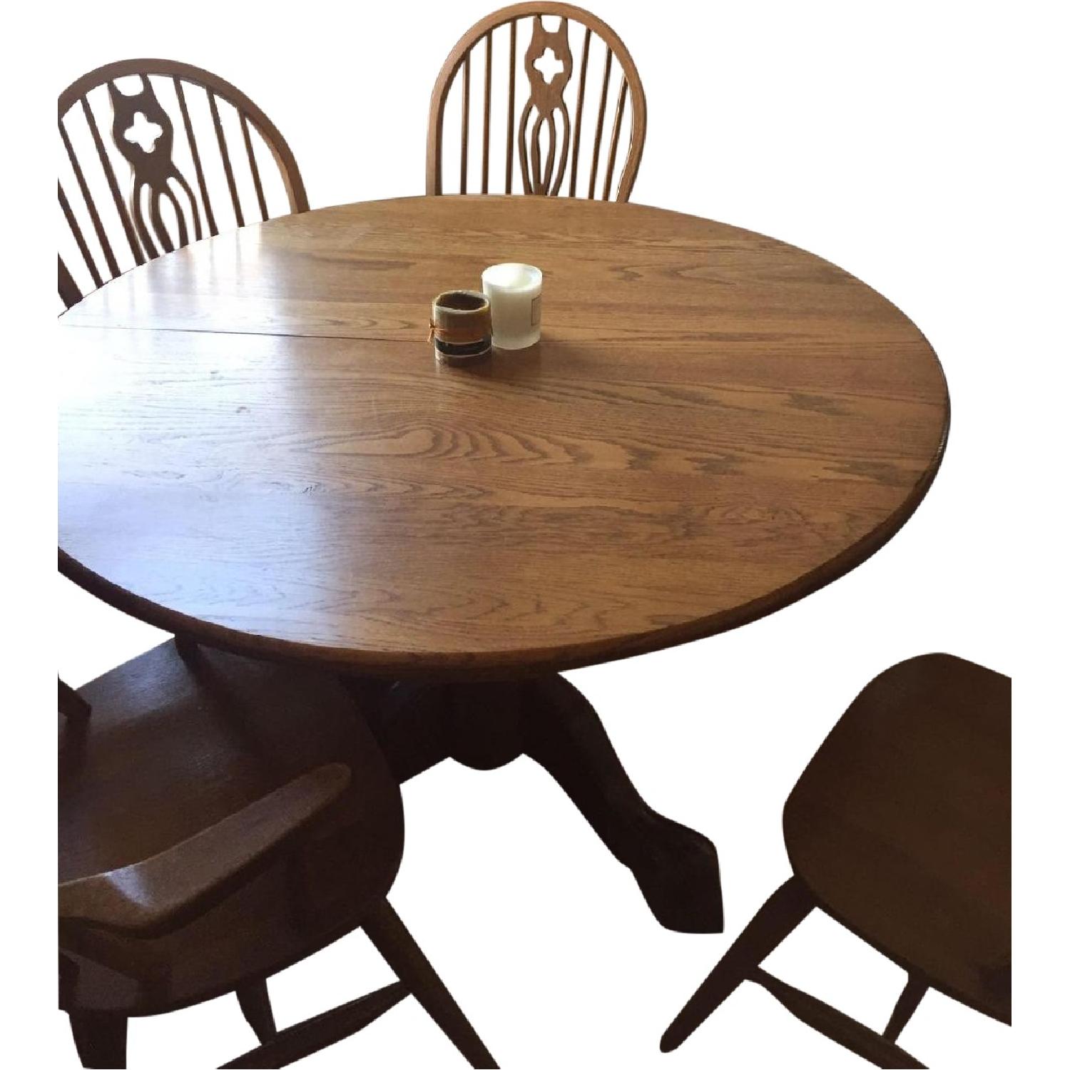 Round Oak Dining Table w/ 4 Chairs - AptDeco