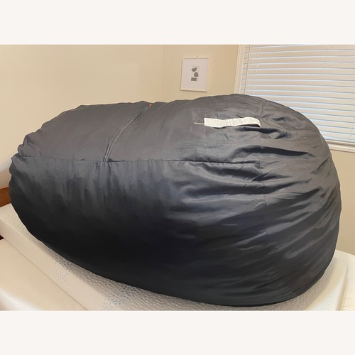 Used Bean Products Black Fabric Ottoman for sale on AptDeco