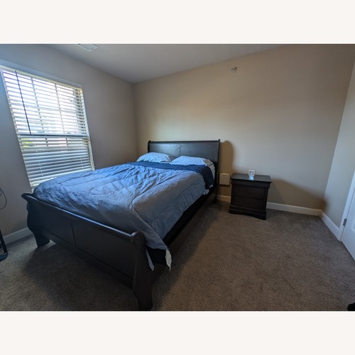 Used Dark Brown Wood Queen Bed for sale on AptDeco