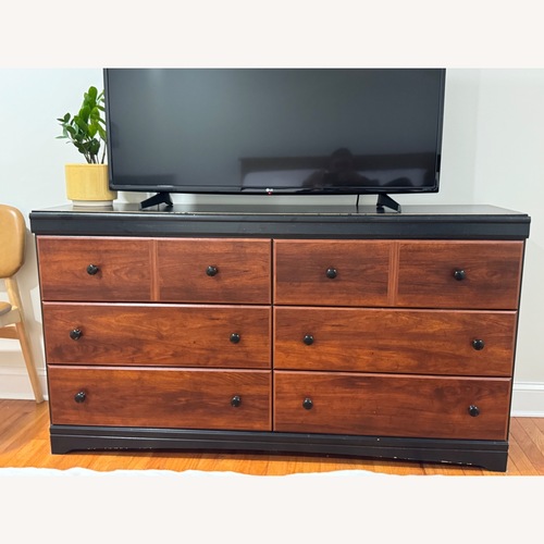 Used Raymour & Flanigan Dark Brown Wood Dresser for sale on AptDeco
