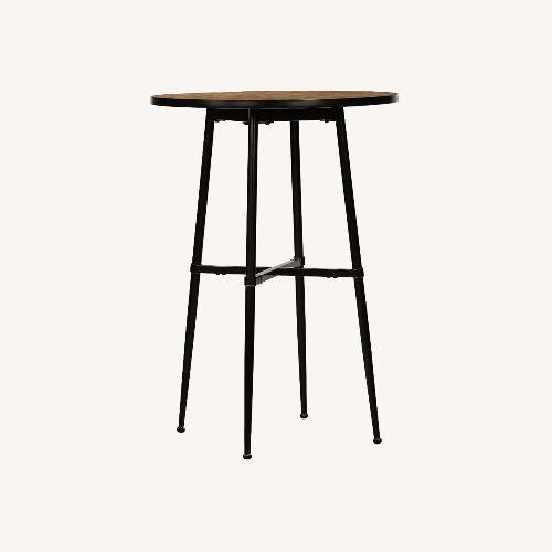 Used Pottery Barn Juno Round Reclaimed Wood Bar Table for sale on AptDeco