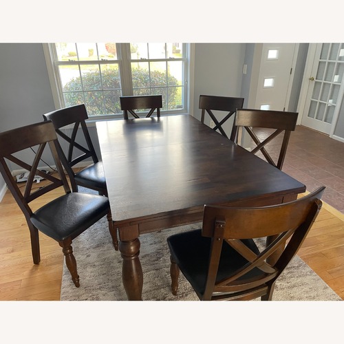 Used Intercon Dark Brown Wood Dining Set for sale on AptDeco