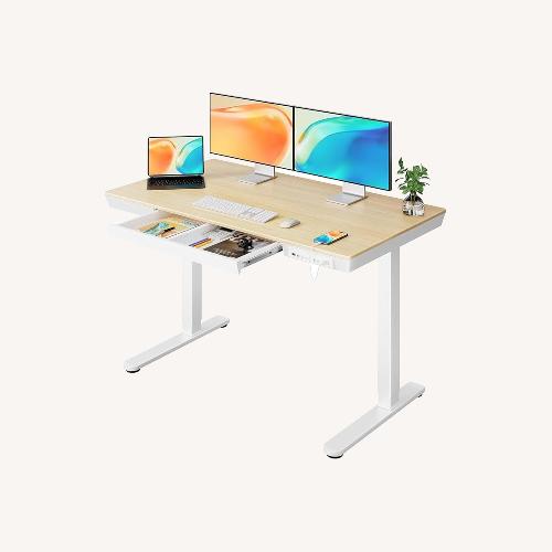 Used Amazon Light Brown Sit-Stand Desk for sale on AptDeco