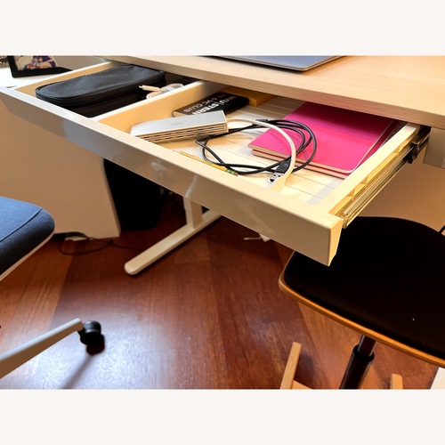 Used Amazon Light Brown Sit-Stand Desk for sale on AptDeco