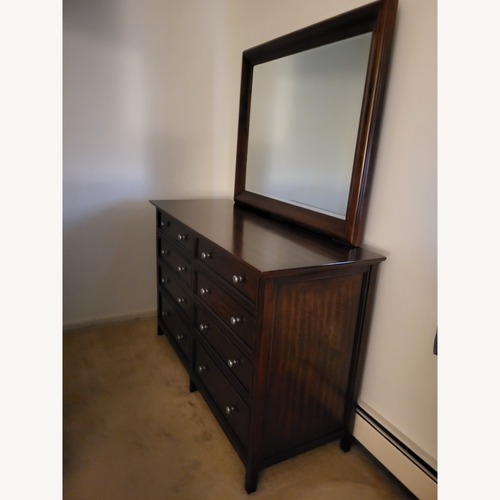 Used Dark Brown Wood Dresser With Mirror for sale on AptDeco