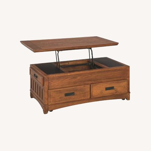 Used Ashley Furniture Light Brown Wood Coffee Table for sale on AptDeco