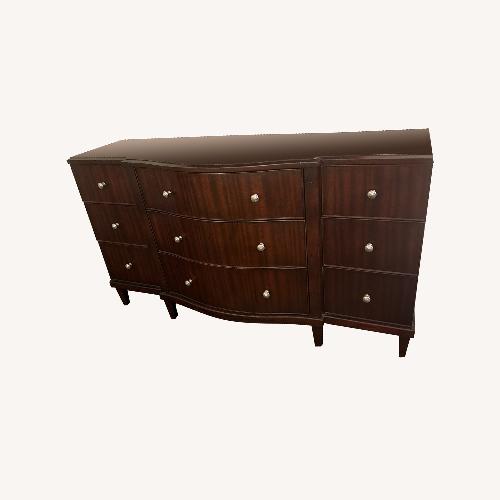 Used Raymour & Flanigan Dark Brown Wood Dresser for sale on AptDeco