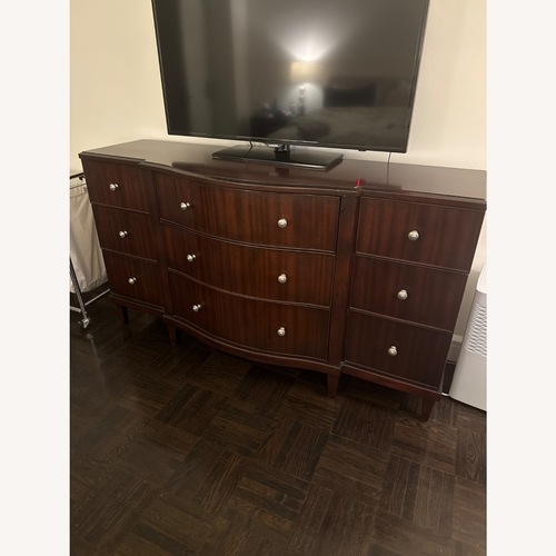 Used Raymour & Flanigan Dark Brown Wood Dresser for sale on AptDeco