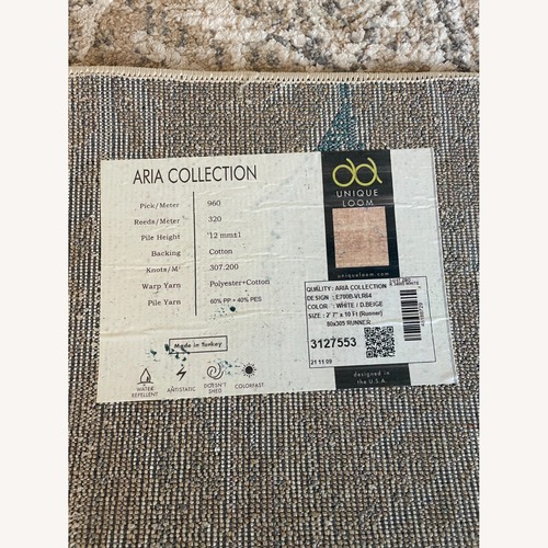 Used Light Brown Runner Rug 10' x 27' for sale on AptDeco