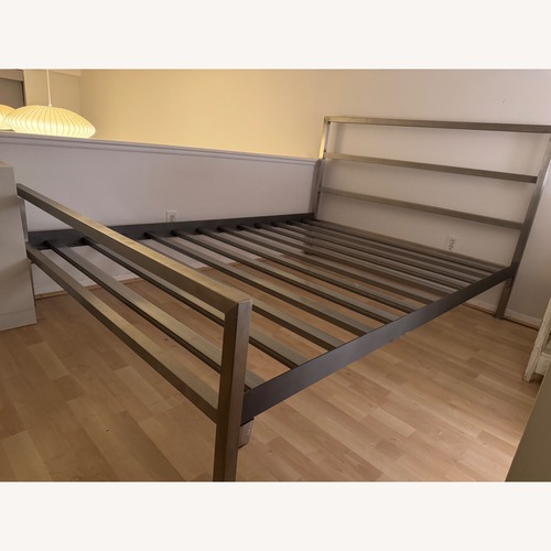 Used Room & Board Silver Stainless Steel Queen Bed for sale on AptDeco