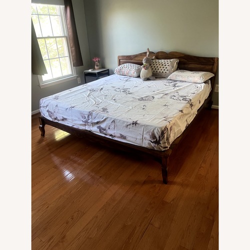 Used IKEA Light Brown Wood King Bed for sale on AptDeco