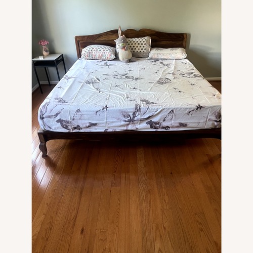 Used IKEA Light Brown Wood King Bed for sale on AptDeco