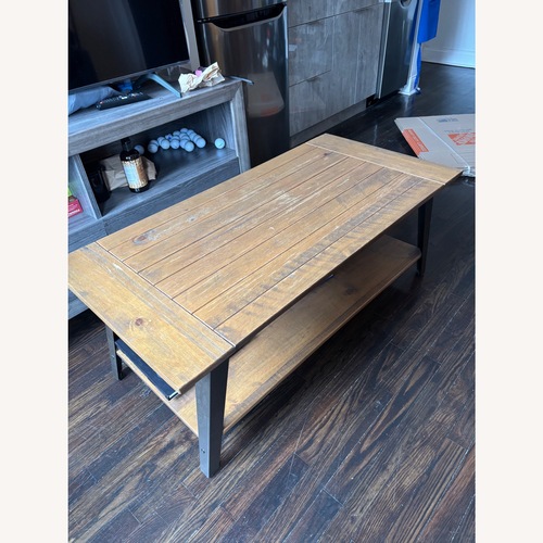 Used Light Brown Wood Coffee Table for sale on AptDeco