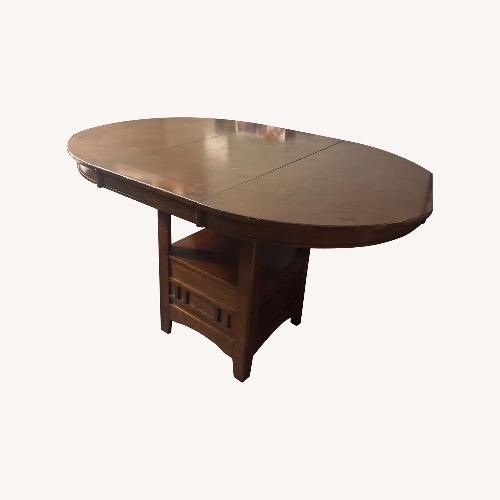 Used Dark Brown Dining Table for sale on AptDeco