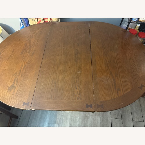 Used Dark Brown Dining Table for sale on AptDeco