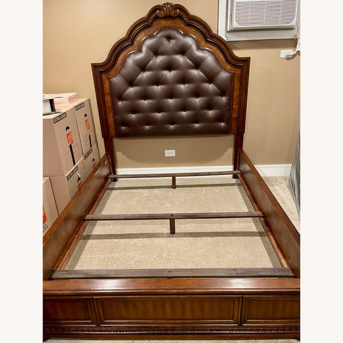 Used Ashley Furniture Dark Brown Wood Queen Bed for sale on AptDeco