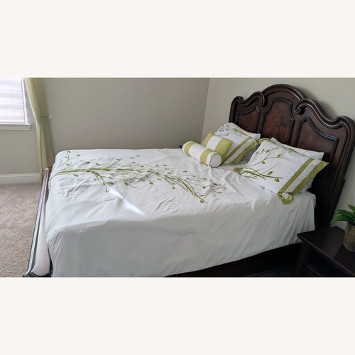 Used Ashley Furniture Dark Brown Wood Queen Bed for sale on AptDeco