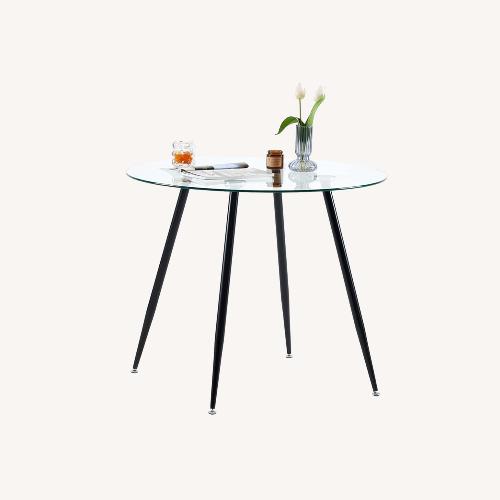 Used Round Glass Dining Table for sale on AptDeco
