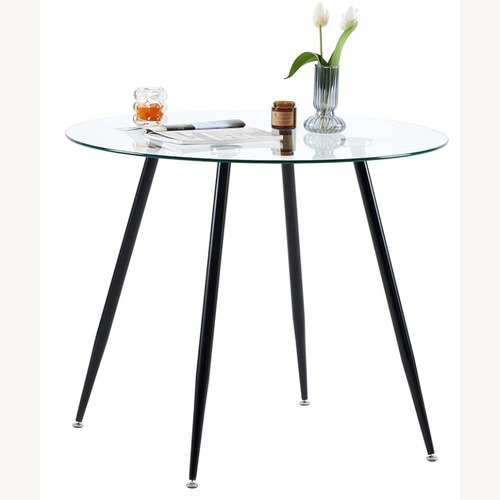 Used Round Glass Dining Table for sale on AptDeco