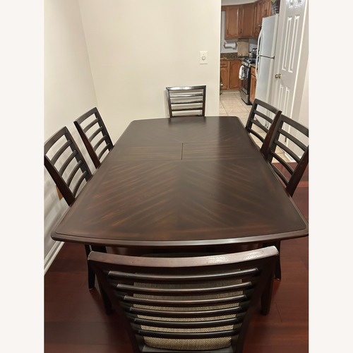 Used Raymour & Flanigan Dark Brown Dining Set for sale on AptDeco