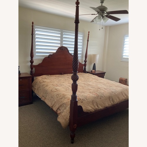 Used Vintage/Antique Vintage Dark Brown Wood king size bed frame for sale on AptDeco