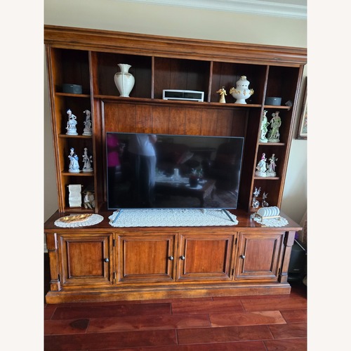 Used Dark Brown Wood Wall Unit for sale on AptDeco