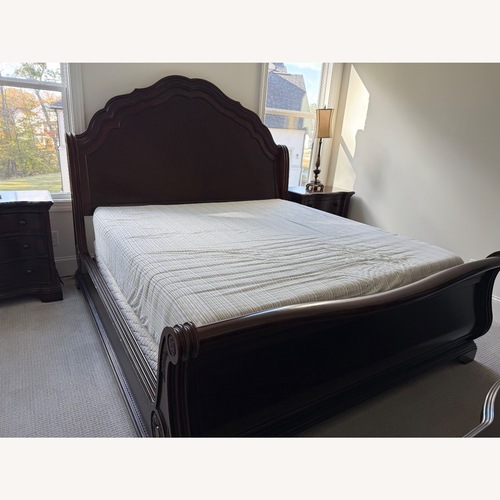 Used Macy's Dark Brown Wood King Bed for sale on AptDeco
