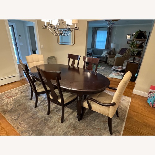 Used Dark Brown Wood Dining Set for sale on AptDeco