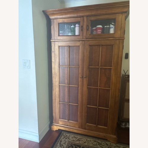 Used Dark Brown Wood Armoire for sale on AptDeco