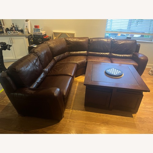 Used Macy's Dark Brown Leather 3+ Piece Sectional for sale on AptDeco