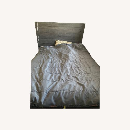 Used Dark Gray Wood Queen Bed for sale on AptDeco