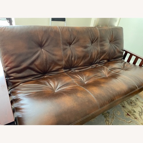 Used Dark Brown Futon Frame W Faux Leather Mattress for sale on AptDeco