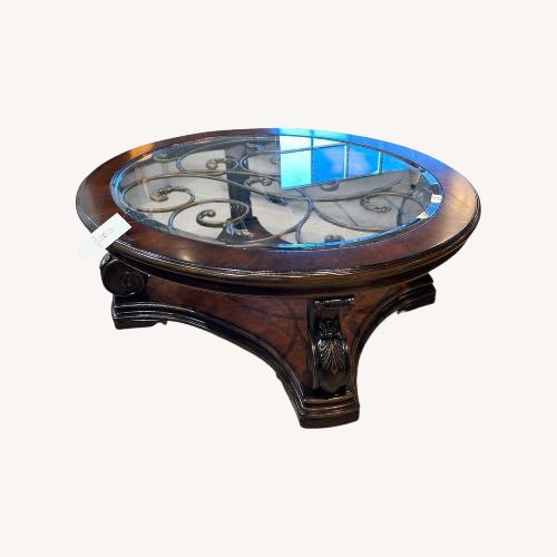 Used Ornate Glass Top Round Coffee Table for sale on AptDeco