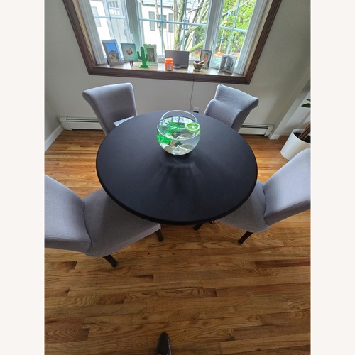 Used Home Goods Black Fabric Dining Table for sale on AptDeco