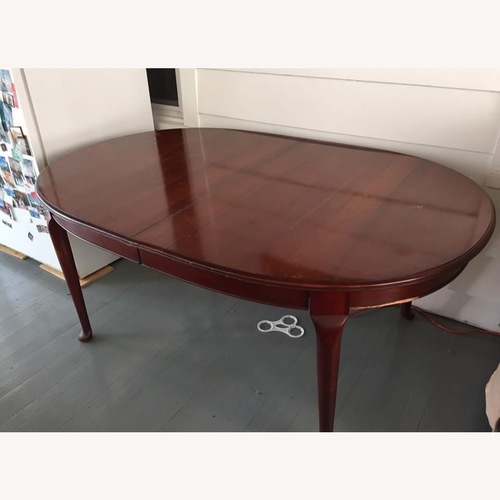 Used Dining Table and Windsor-Style Chair Set Of 4 for sale on AptDeco