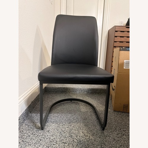 Used Saskia Black Leather Dining Chairs for sale on AptDeco