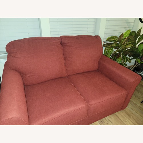 Used Ashley Furniture Red Fabric Sleeper Sofa for sale on AptDeco
