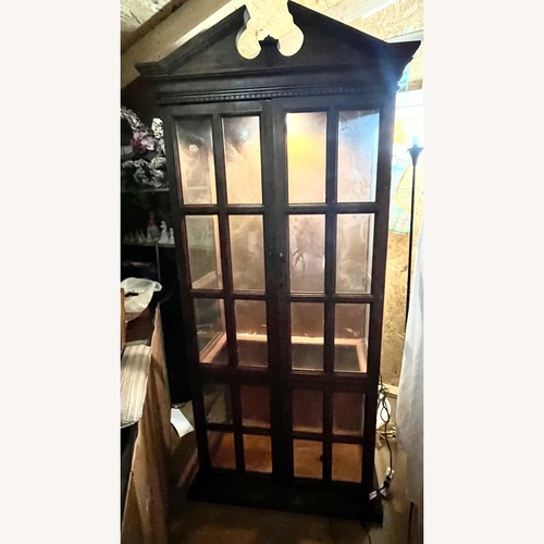 Used Vintage/Antique Dark Brown Wood Armoire for sale on AptDeco