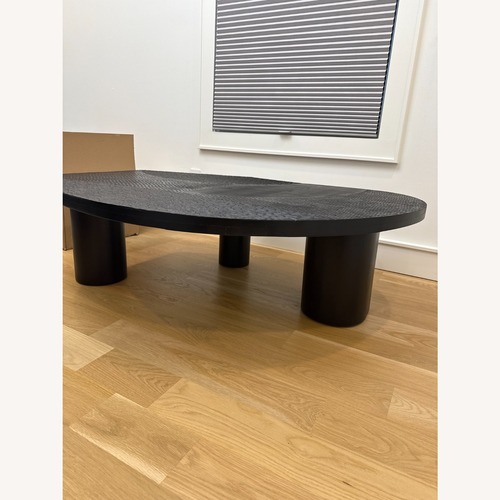 Used Arteriors Home Black Wood Coffee Table for sale on AptDeco