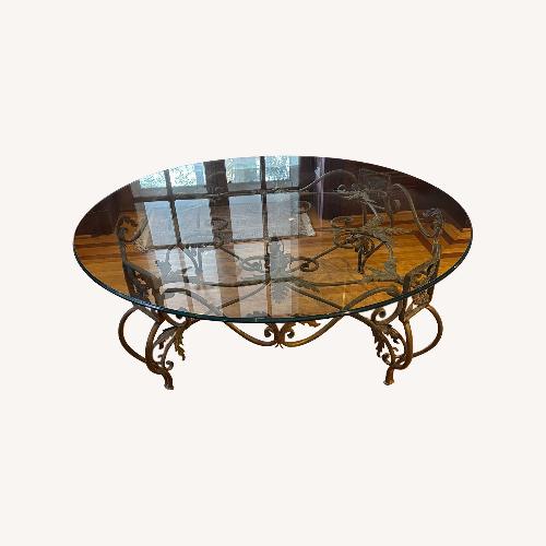 Used Elegant Large Round Beveled Glass Cocktail Table for sale on AptDeco