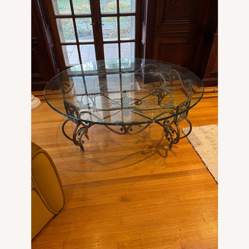 Used Elegant Large Round Beveled Glass Cocktail Table for sale on AptDeco