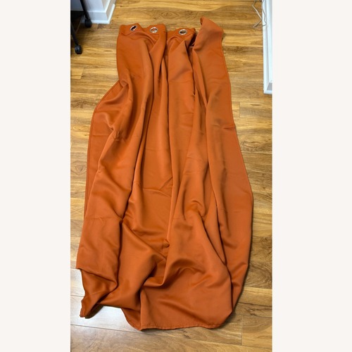 Used Orange Blackout Curtain Set with Rod & Bracket for sale on AptDeco