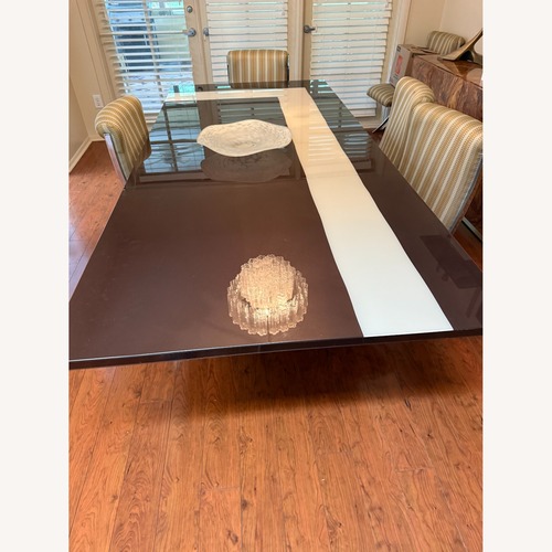 Used Dark Brown Wood Dining Table for sale on AptDeco
