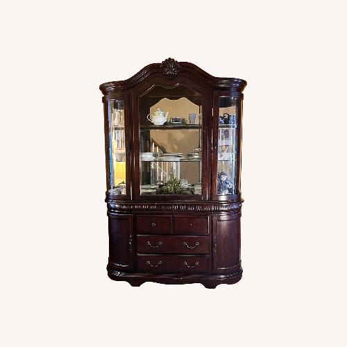 Used Dark Brown Wood Armoire for sale on AptDeco