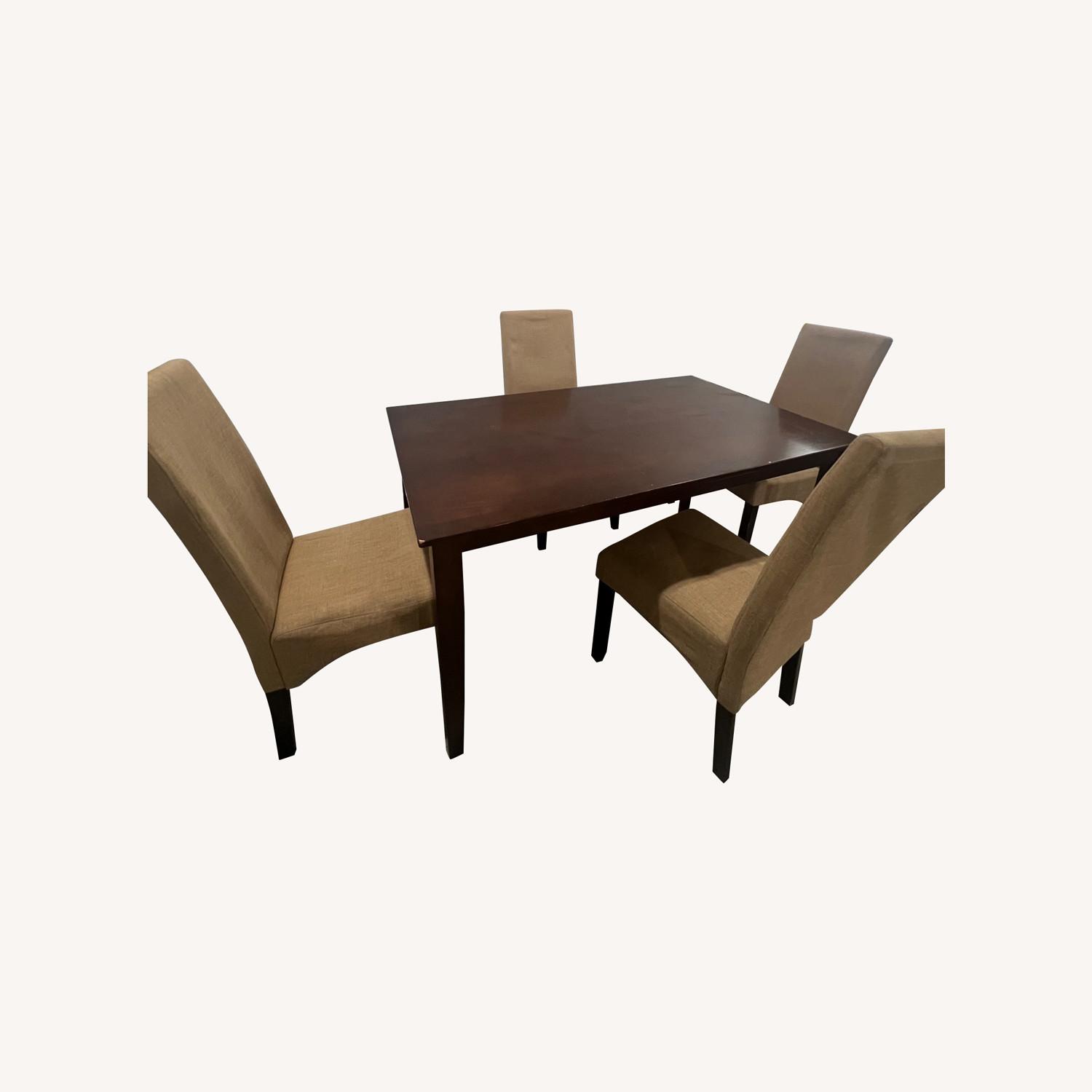Brown Table With Tan Chairs - image-0