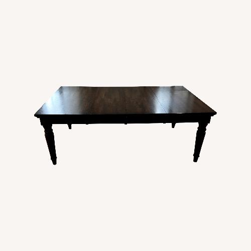 Used World Market Dark Brown Wood Dining Table for sale on AptDeco