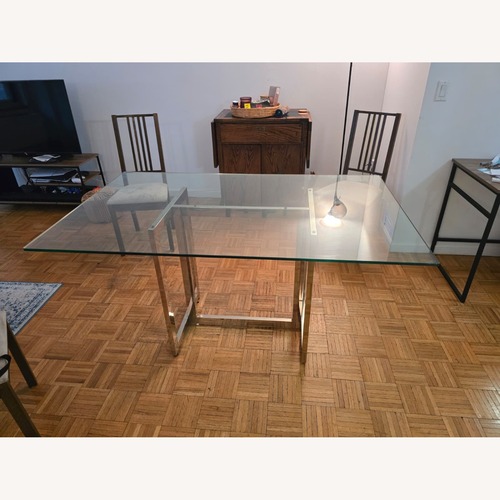 Used West Elm Silver 60" Chrome and Glass Dining Table for sale on AptDeco