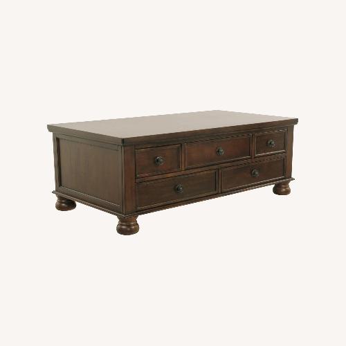 Used Living Spaces Dark Brown Wood Coffee Table for sale on AptDeco