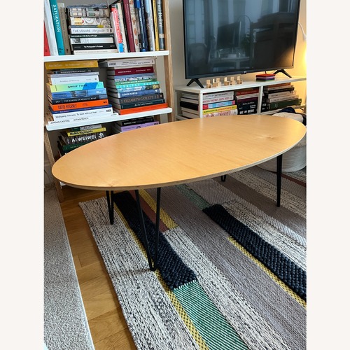 Used Inside Weather Latte Oval Coffee Table for sale on AptDeco